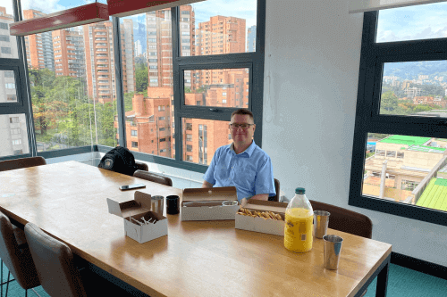 Can I Work Remotely From Another Country - Matt Francis Sitting in office in Medellin