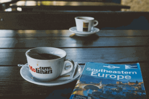 Essential Steps For Planning A Trip - Lonely Planet Guide and coffees