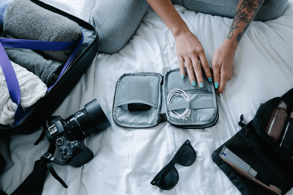 Camera, cables, sunglasses, packed essentials